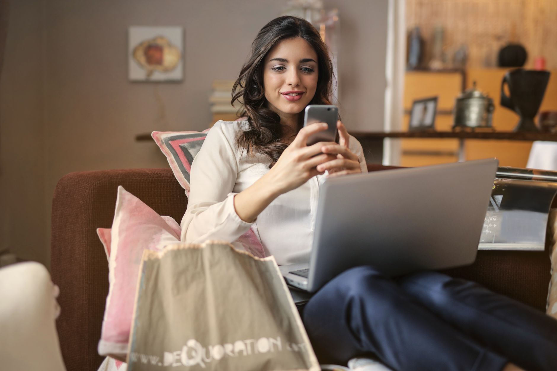 woman using smartphone laptop