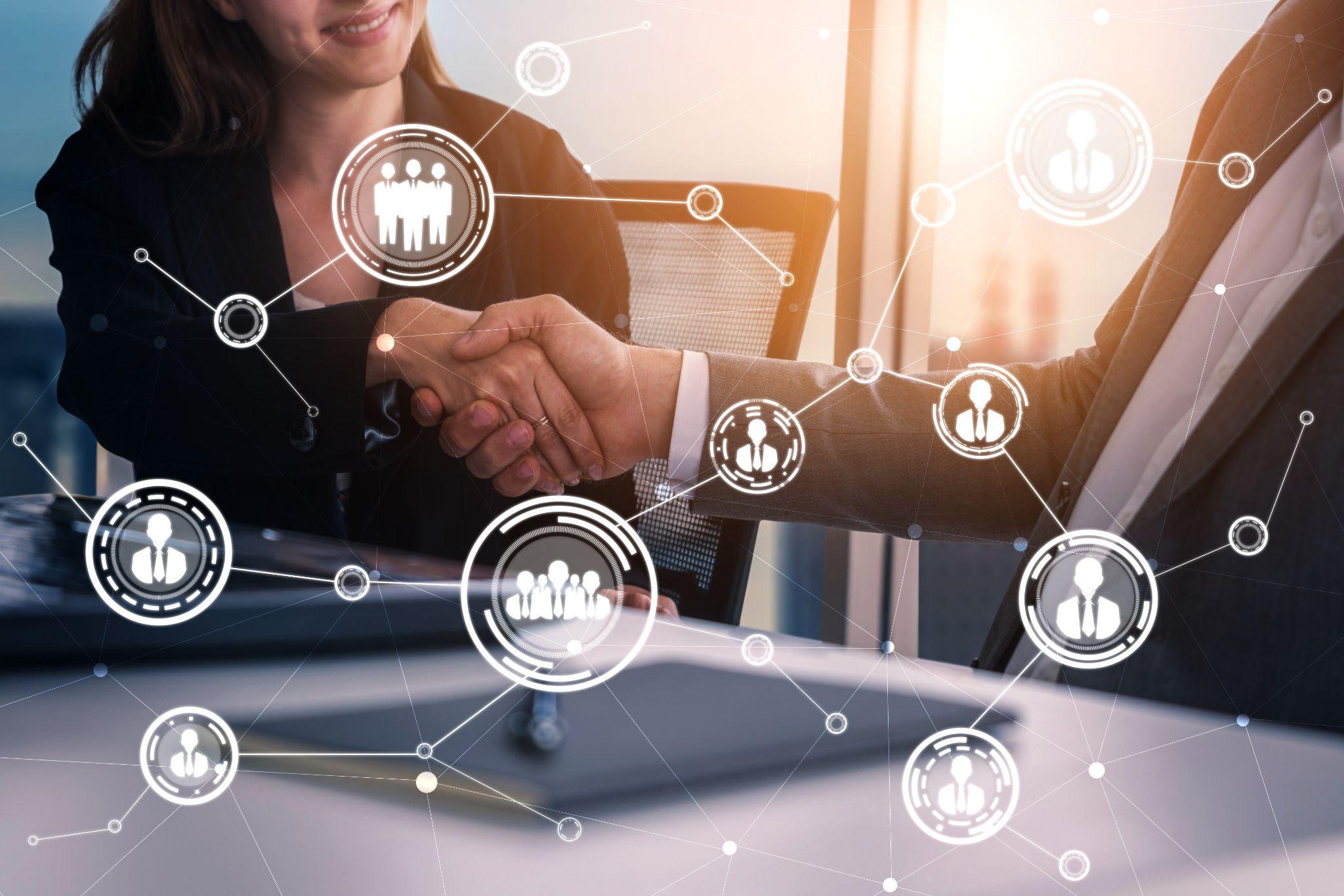 握手するビジネスパーソンとネットワーク図