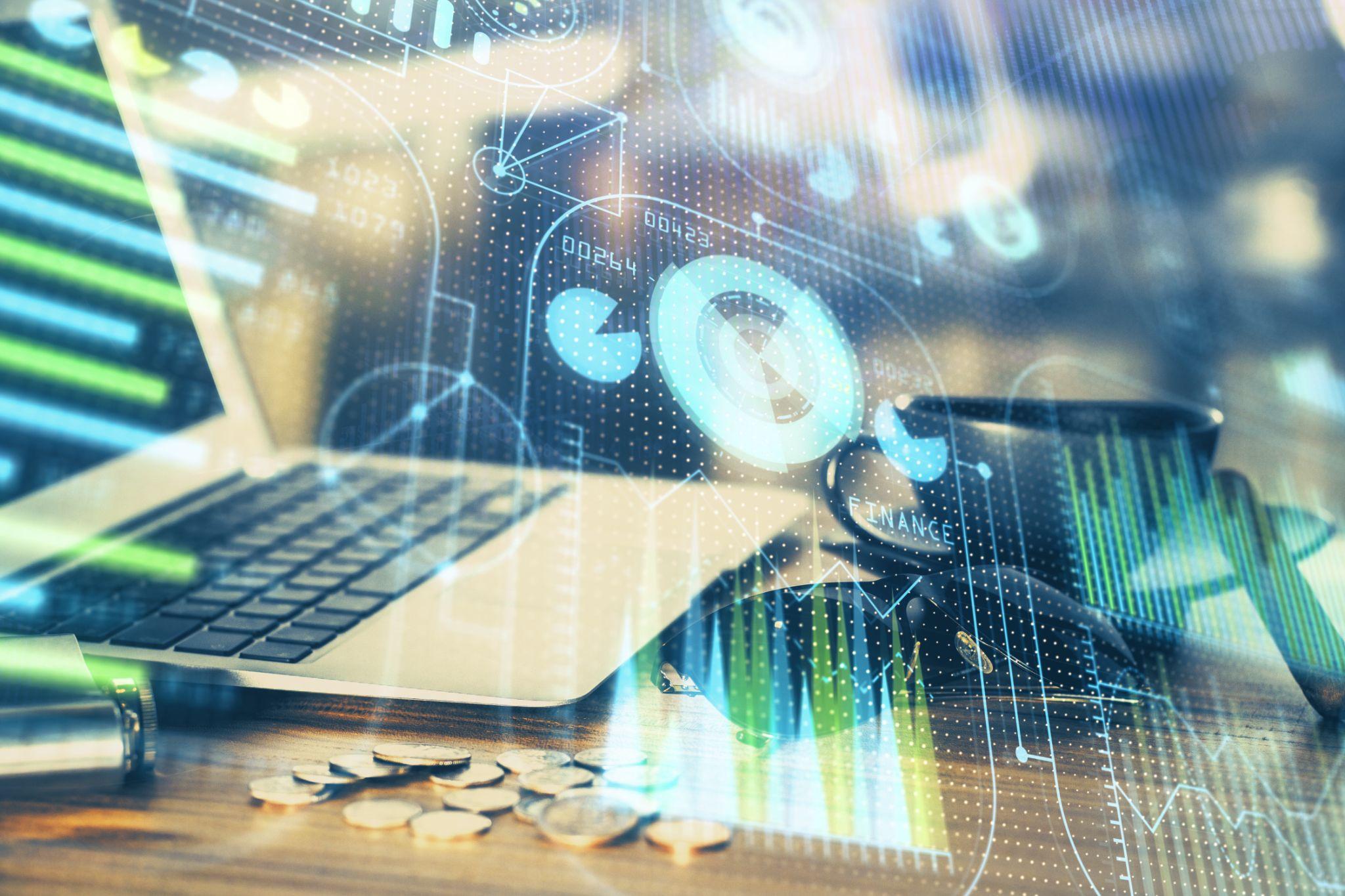 PCとデータが重なるイメージ。IT活用と効率化を示す。