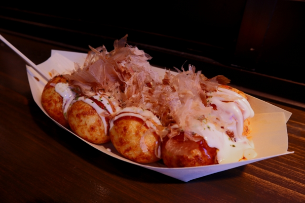 Takoyaki in a take-away tray