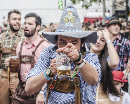 Man with a large hat and a jug.