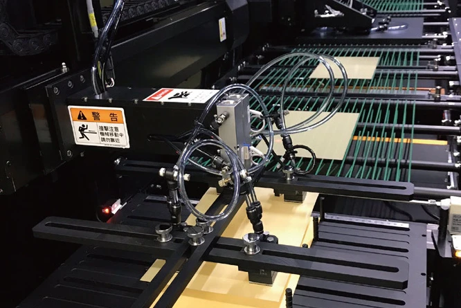繊維製品の欠陥を正確に発見　AI活用の光学検査装置