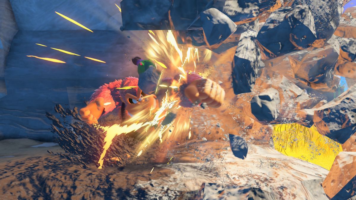 ドンキーが岩をパンチで破壊していて、砕けた岩が飛び散っている。