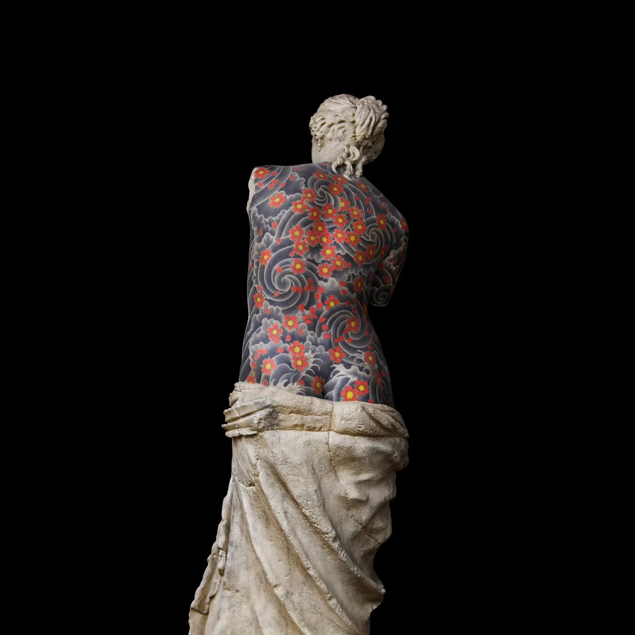 The same figure from behind, her back above the drapery covered in swirling waves and red flowers