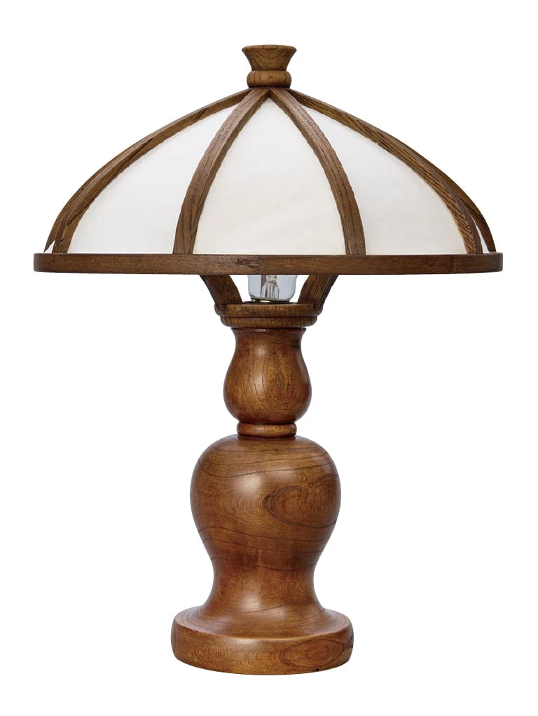 A table lamp with a domed shade of white paper on a wooden frame, on a turned wooden base