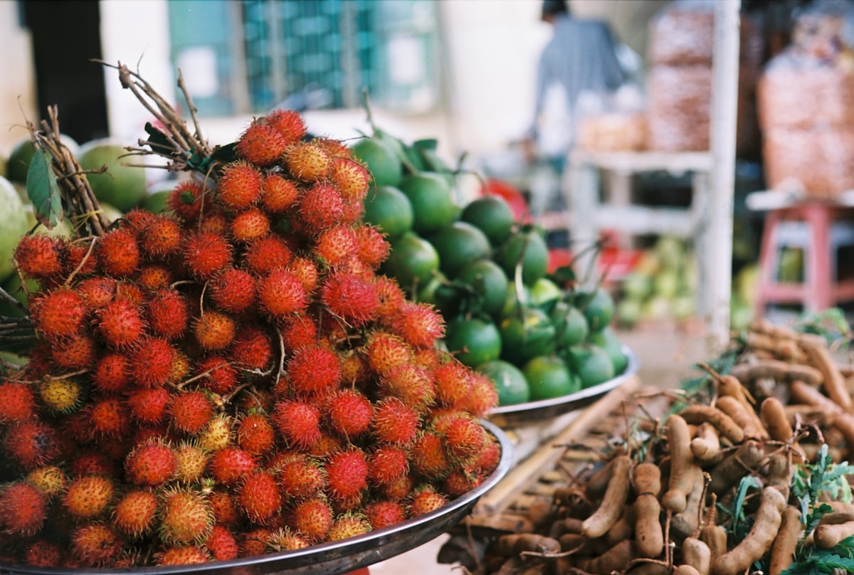 Fresh rambutan, limes, and tamarind at market