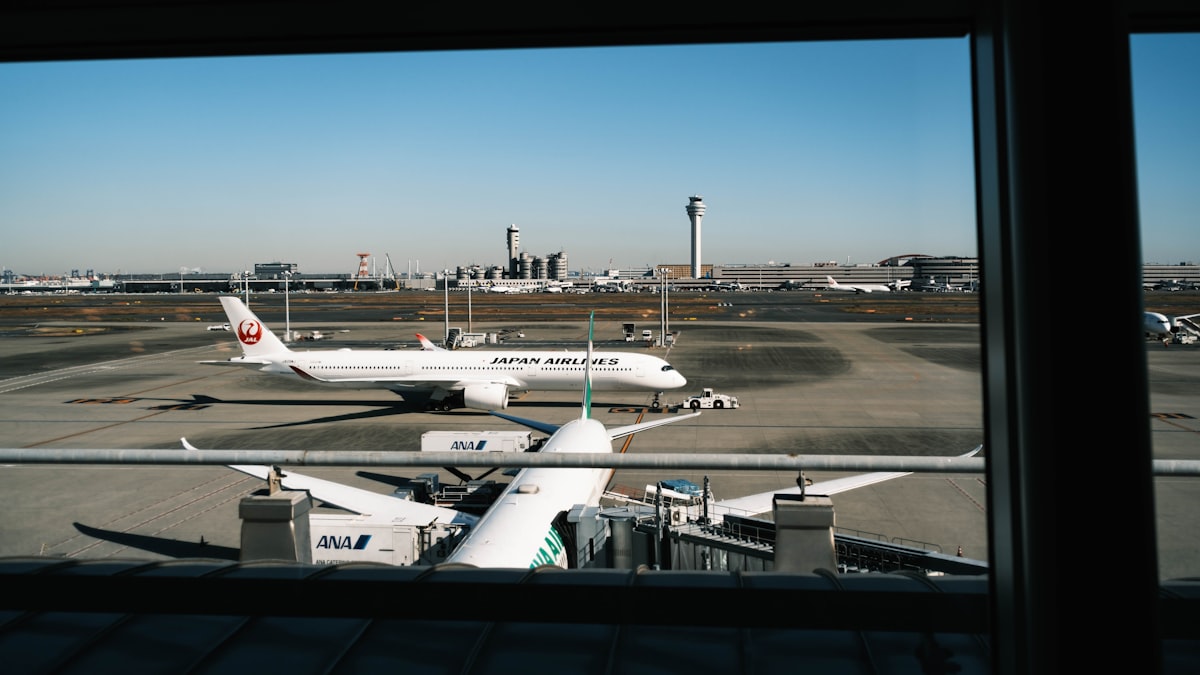 Airplanes parked at an airport terminal