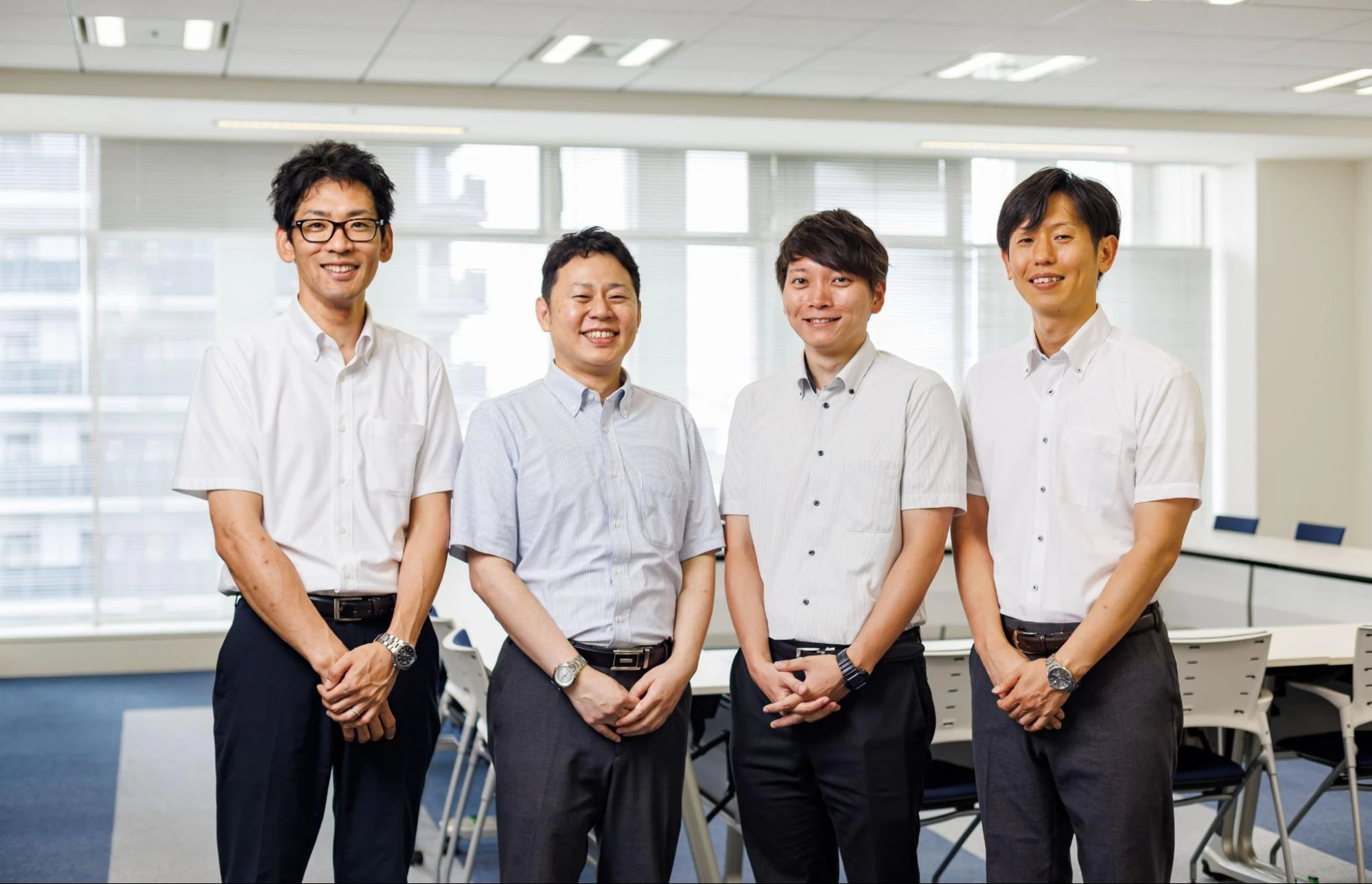 会議室に並んで立つJAあいち経済連の林さん、亀井さん、大澤さん、鳥居さん