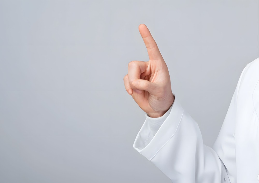 人差し指でさす様子