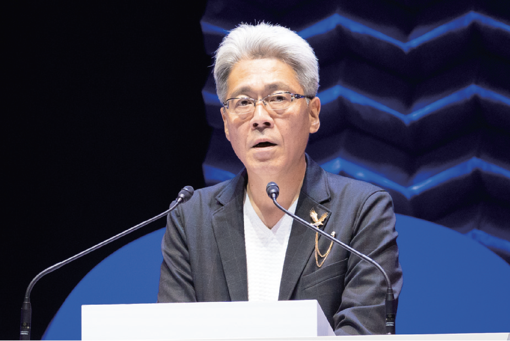 上廣哲治代表の講演では、会場は落ち着いた雰囲気に。